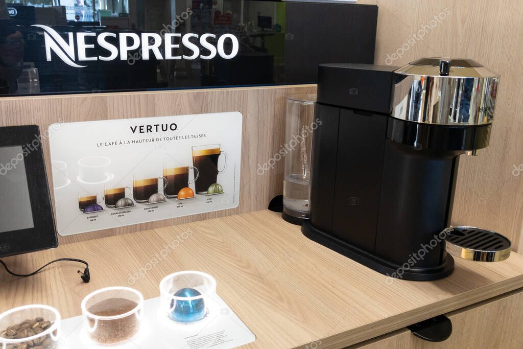 Bordeaux , Aquitaine France - 11 05 2021 : Nespresso logo sign and brand text capsule coffee machine stand for sale in cafe makers store
