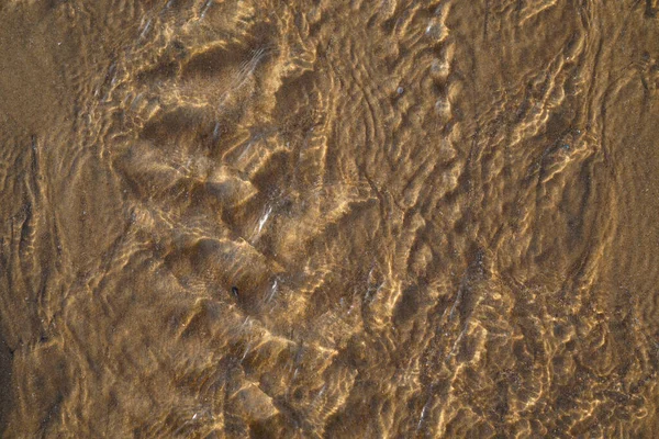 平らな海の砂のビーチの海潮のトップビュー 海の砂の背景 — ストック写真