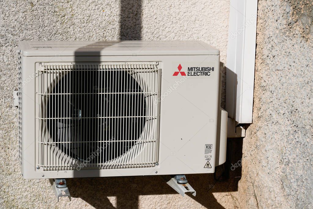 Bordeaux , Aquitaine  France - 12 20 2021 : mitsubishi electric air conditioner logo text and brand sign on equipment conditioning modern outside wall building