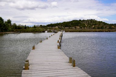 lake wooden pontoon of Peyriac-de-Mer France Travel and Vacation in Freedom Concept