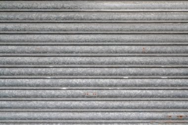 Gri çelik mekiğin arka plan desenleri yuvarlanan metal kapılar gri metal perde modern kapının arka planı