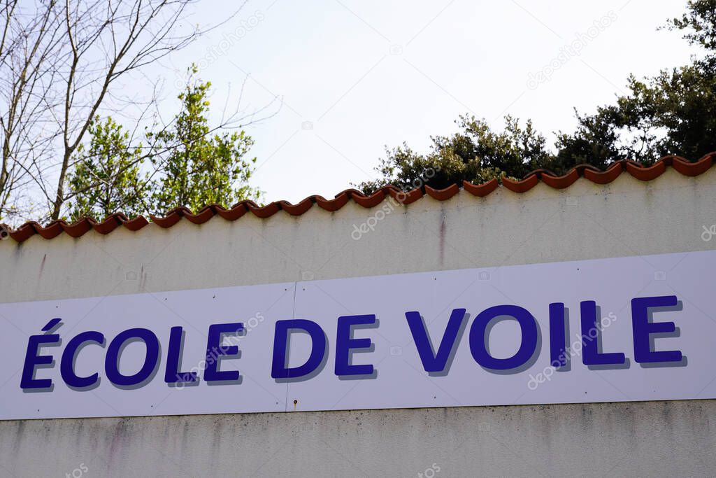 ecole de voile French text means sailing school logo brand and sign text on facade building
