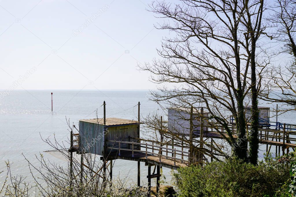 Fishing huts wooden with nets in Meschers-sur-Gironde