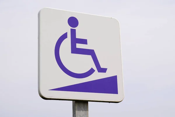 disabled accessible entry sign post with wheelchair handicap logo pmr means  people someone with reduced mobility access pictogram