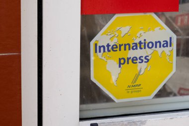 Bordeaux , Aquitaine  France - 05 04 2022 : international press logo brand sticker and sign text on windows door facade entrance newspaper retail shop entrance