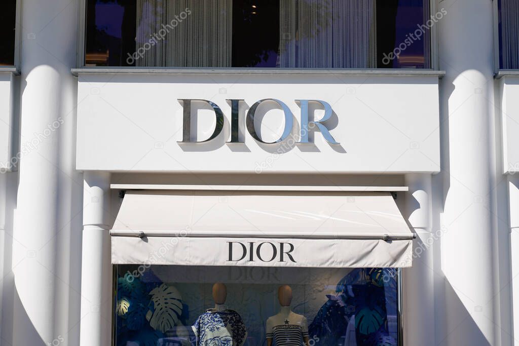 Cannes , paca , France - 06 12 2022 : Christian Dior brand logo of company text sign wall of fashion clothing industry facade of retail shop and store