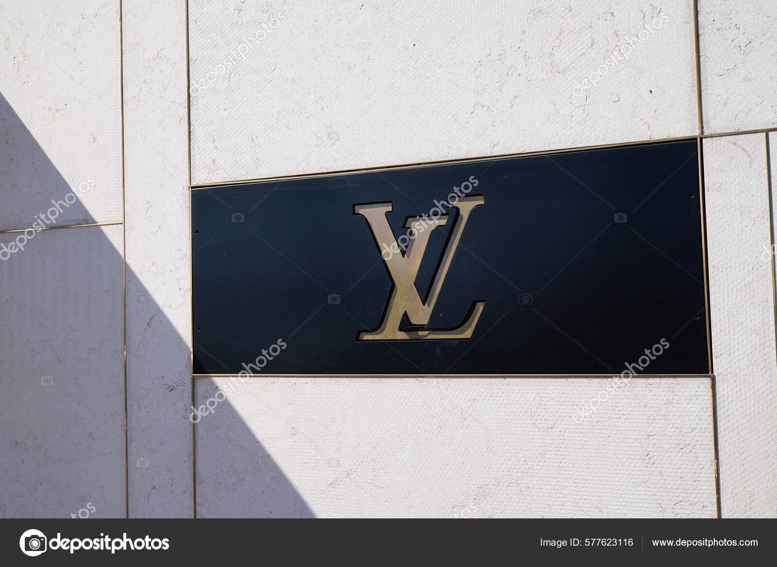 louis vuitton logo and sign text facade entrance store fashion brand  clothes shop in street view Stock Photo