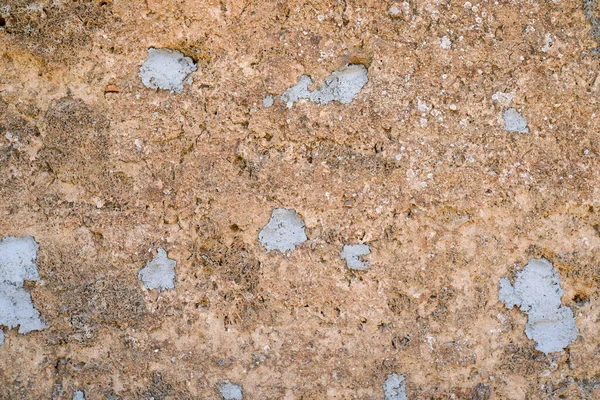 古いベージュの石素朴なセメント古いファサードの建物の背景 — ストック写真