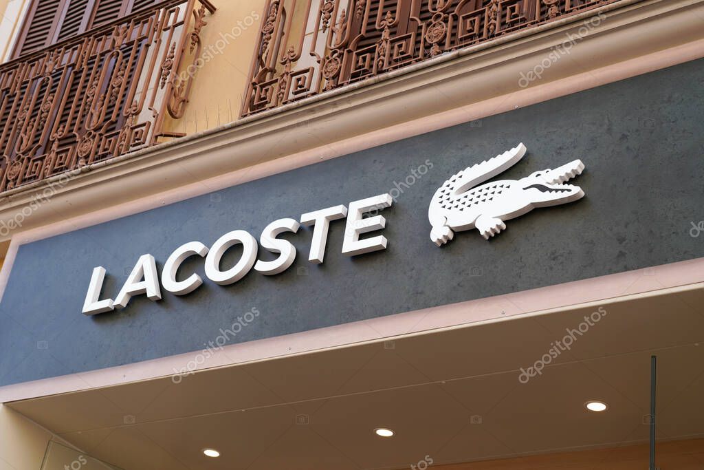 Bordeaux , Aquitaine  France - 07 01 2022 : lacoste boutique brand logo and sign text on facade entrance fashion front store