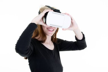 Blonde woman in virtual reality goggles Studio shot on white background