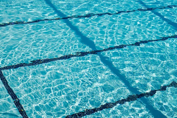 blue mosaic tile background of a public swimming pool water