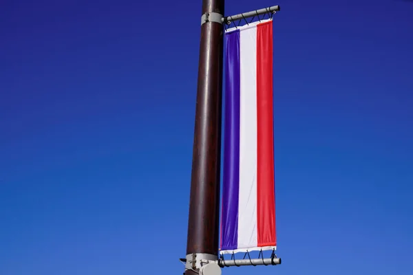 France Flag Hanging Long Mast Front Blue Sky — Stockfoto