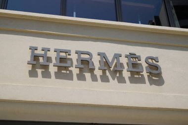Biarritz , Aquitaine  France - 08 08 2022 : Hermes logo text and facade sign front of entrance store French manufacturer Hermes shop luxury brand