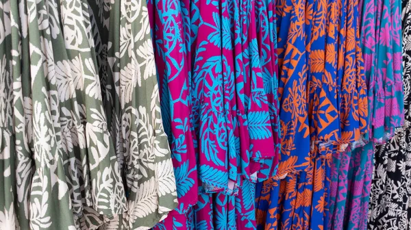 Different Dresses Patterned Fabric Shop Fashionable Background Interior Clothing Store — Foto de Stock