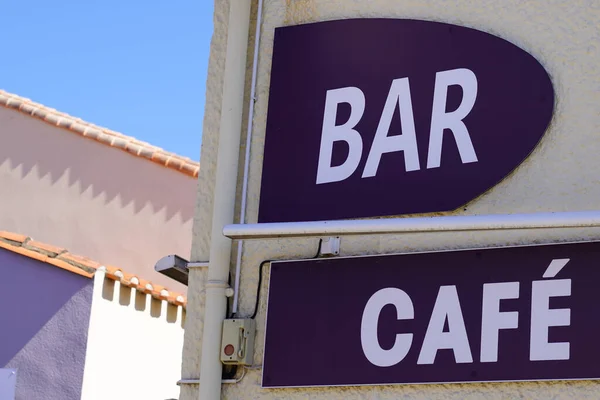 bar cafe french sign text on facade wall pub in city street storefront building coffee entrance