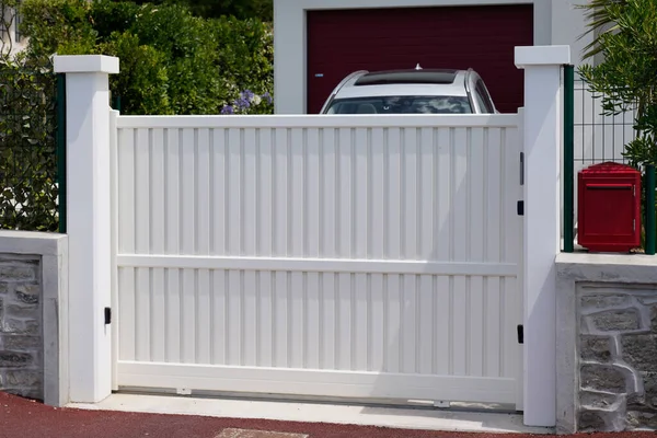street suburb home high white metal aluminum house gate slats garden access door