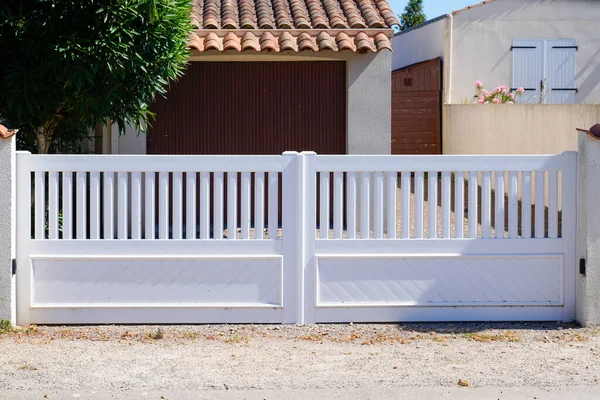 white entry plastic pvc home gate polyvinyl chloride portal of home door of suburbs house in street view