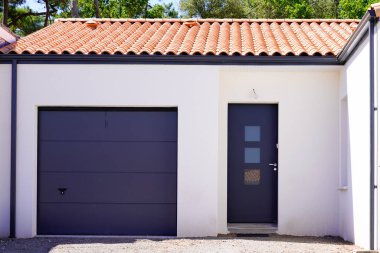 sectional entrance facade home garage of modern new building house in suburb street view