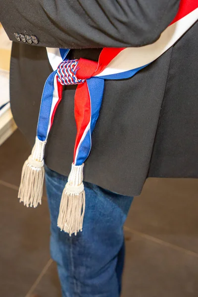 french man mayor tricolor blue white red scarf during an official celebration in france city hall