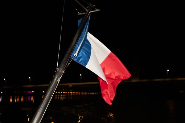 French tricolors blue white red flag fluttering waving front on mat night boat
