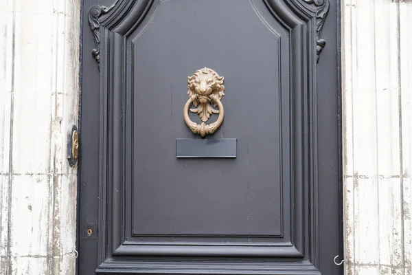 old knock door on grey classical wooden antique door with metal knocker decorative furniture