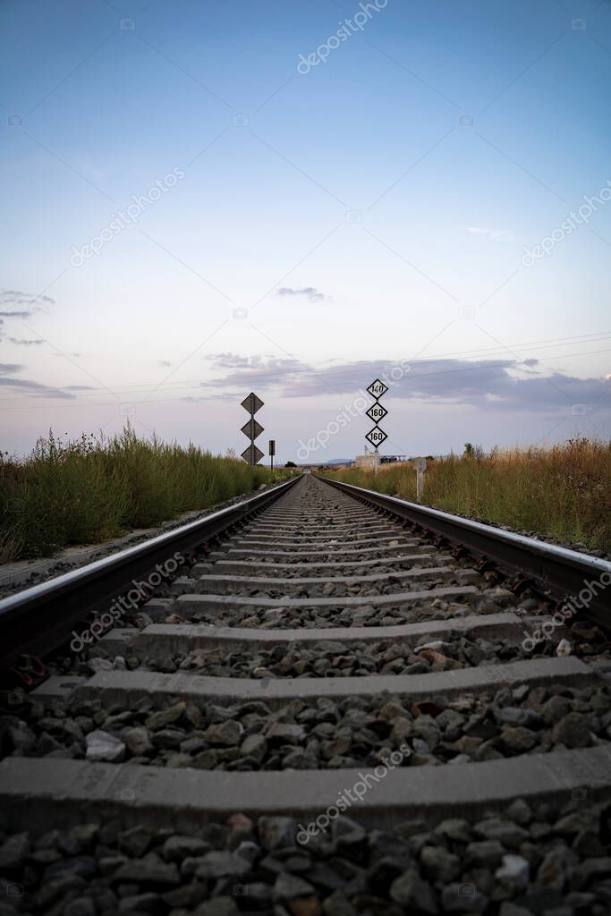 passage of lonely train tracks with railway signals