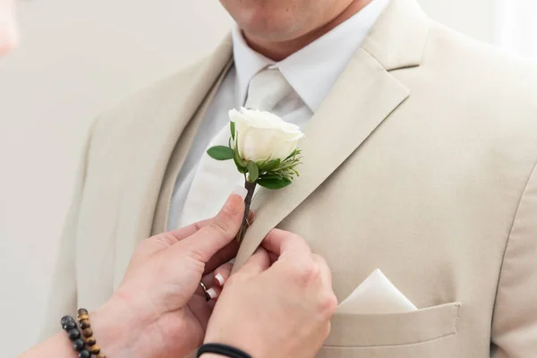 Groom Has Helping Hands Manicure Assisting Him Pinning His Flower — стокове фото