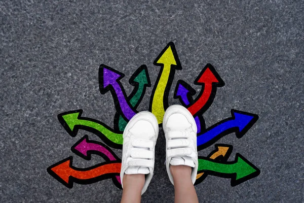 Choice Concept Feet Walking Away Colorful Graffiti Direction Arrows Road — стоковое фото