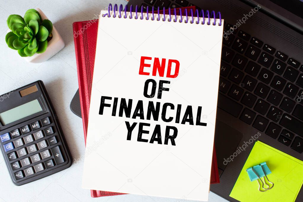 Text sign showing End Of Financial Year. Conceptual photo Taxes time accounting June database cost Sheets written by Man on plain background Markers next to it.