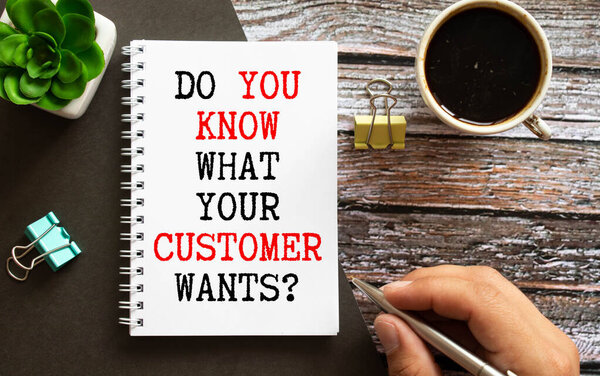 Do you know your CUSTOMER on a table with sticks, colored paper clips and wrinkled sheets.