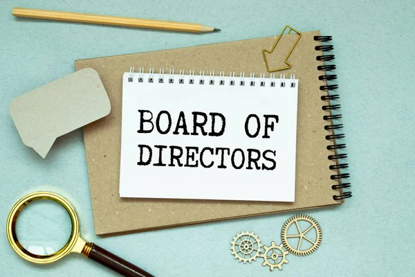 BOARD OF DIRECTORS, text on white paper on a gray background near a coffee cup