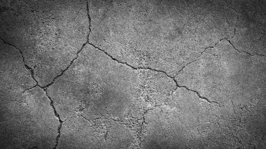 Arkaplan resmi, çatlamış beton zemin ya da duvar.