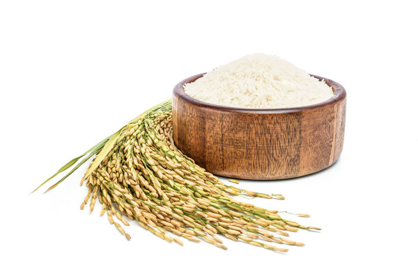  Rice in a wooden bowl with grains on a white background