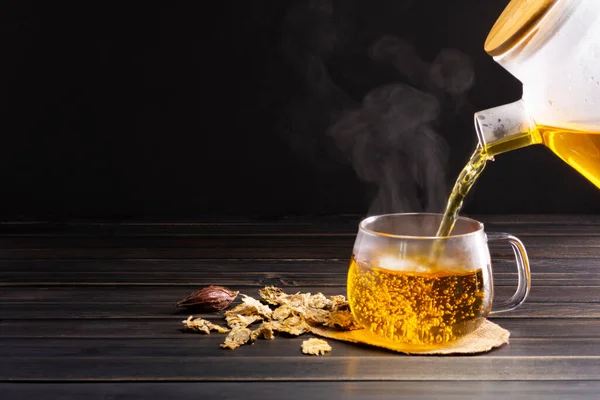 Brew hot tea, chrysanthemum tea and chrysanthemum flowers. Placed on a wooden table Healthy drinks to drink herbs and medical concepts