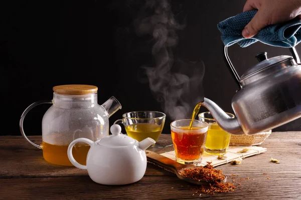 Brew hot tea, chrysanthemum tea, and chrysanthemum flowers. Safflower arranged on a wooden table Healthy drinks to drink herbs and medical concepts