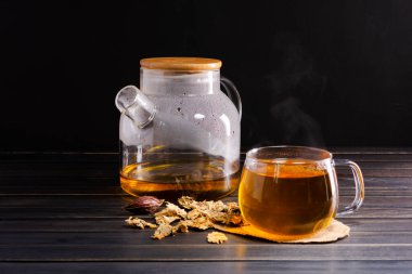 Brew hot tea, chrysanthemum tea and chrysanthemum flowers. Placed on a wooden table Healthy drinks to drink herbs and medical concepts