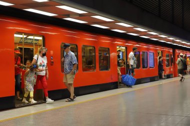 Helsinki, Finland - August 20, 2022: A Helsinki metro train calling at the Hakaniemi subway station.