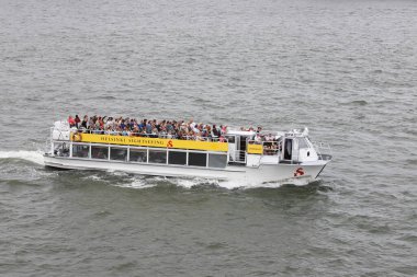Helsinki, Finland - August 20, 2022: High angle view of passengers seated on sun deck during the sightseeing tour in the harbour by the operator Stromma.