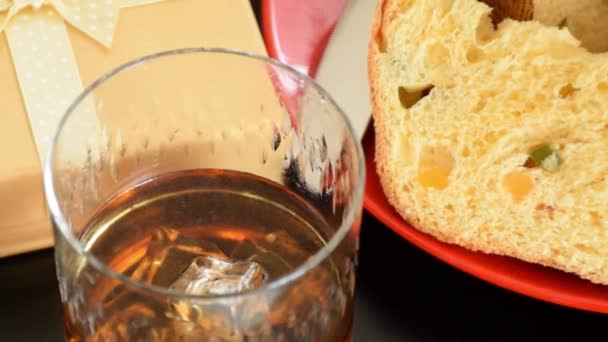 Close Whiskey Glass Ice Smoke Next Slice Panettone_Tracking Side — Stock Video