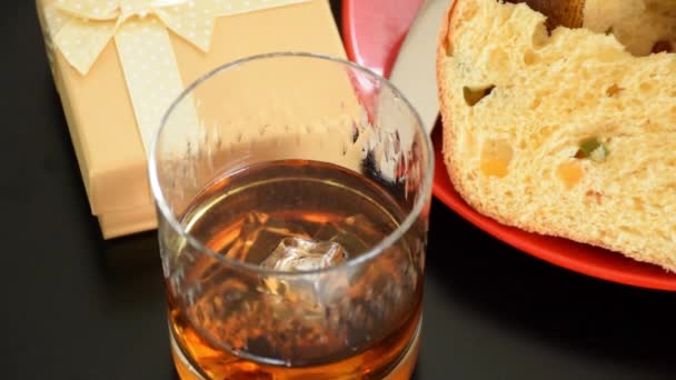 Close Whiskey Glass Ice Smoke Next Slice Panettone Zoom — Stock video