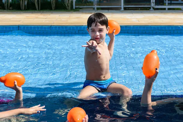 Year Old Child Sitting Edge Pool Ready Throw Water Bomb — Stock Photo, Image