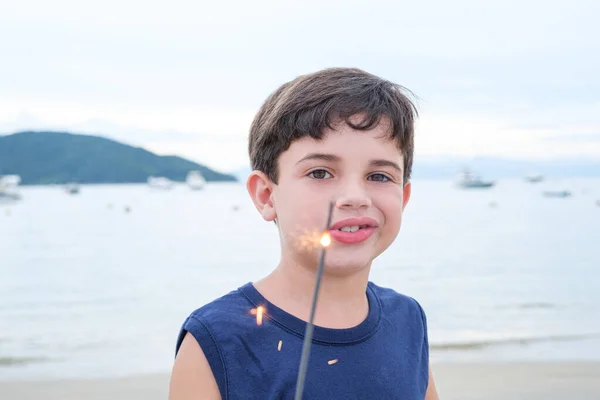 Brazilian Child Holding Sparkles Candle Beach — ストック写真