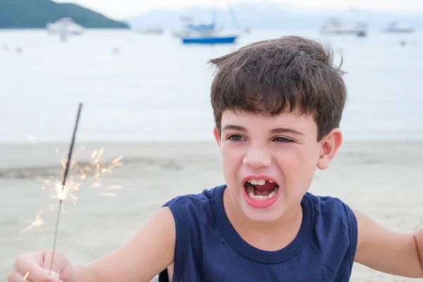 Year Old Child Holding Candle Sparkles Sand Beach His Mouth — Stockfoto