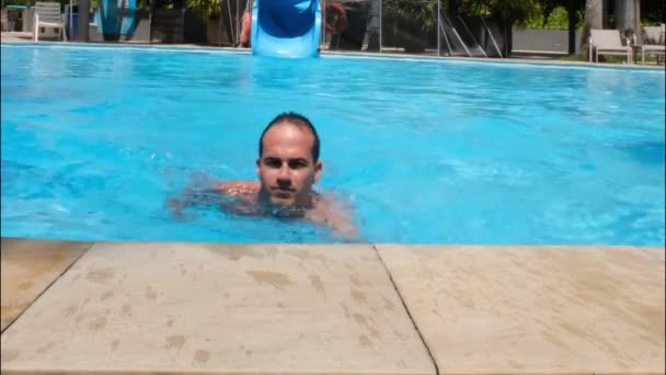 Year Old Man Swimming Edge Pool Waving Camera – Stock-video