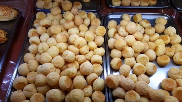 Several Cheese Puffs Being Displayed Brazilian Bakery Showcase — Stok video