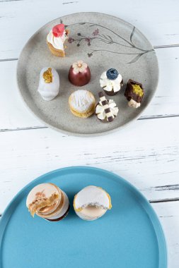 Wedding sweet treats alongside fancy candies and stacked macarons.