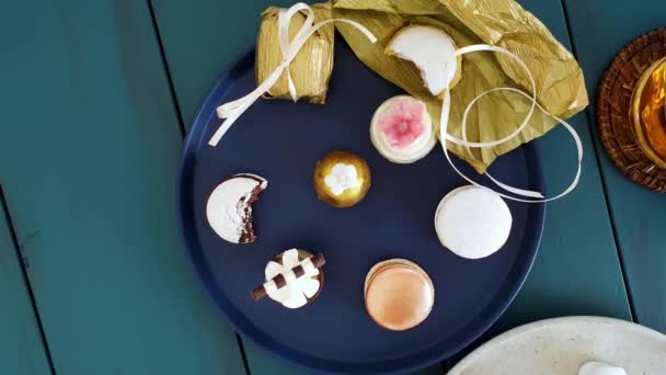 Sophisticated Sweets Plates Top View Glass Whiskey Macaron Walnut Cameo — 图库视频影像