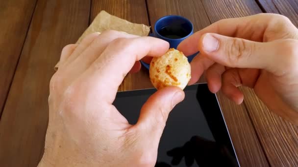 Man Taking Splitting Brazilian Cheese Bread Half Next Cup Coffee — Stockvideo