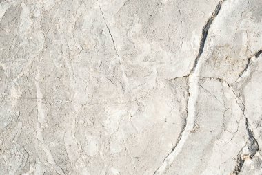 Kireçtaşı tabakalarının ve çatlakların doğal deseni. Sert tortul kaya dokusu. Soyut arkaplan.