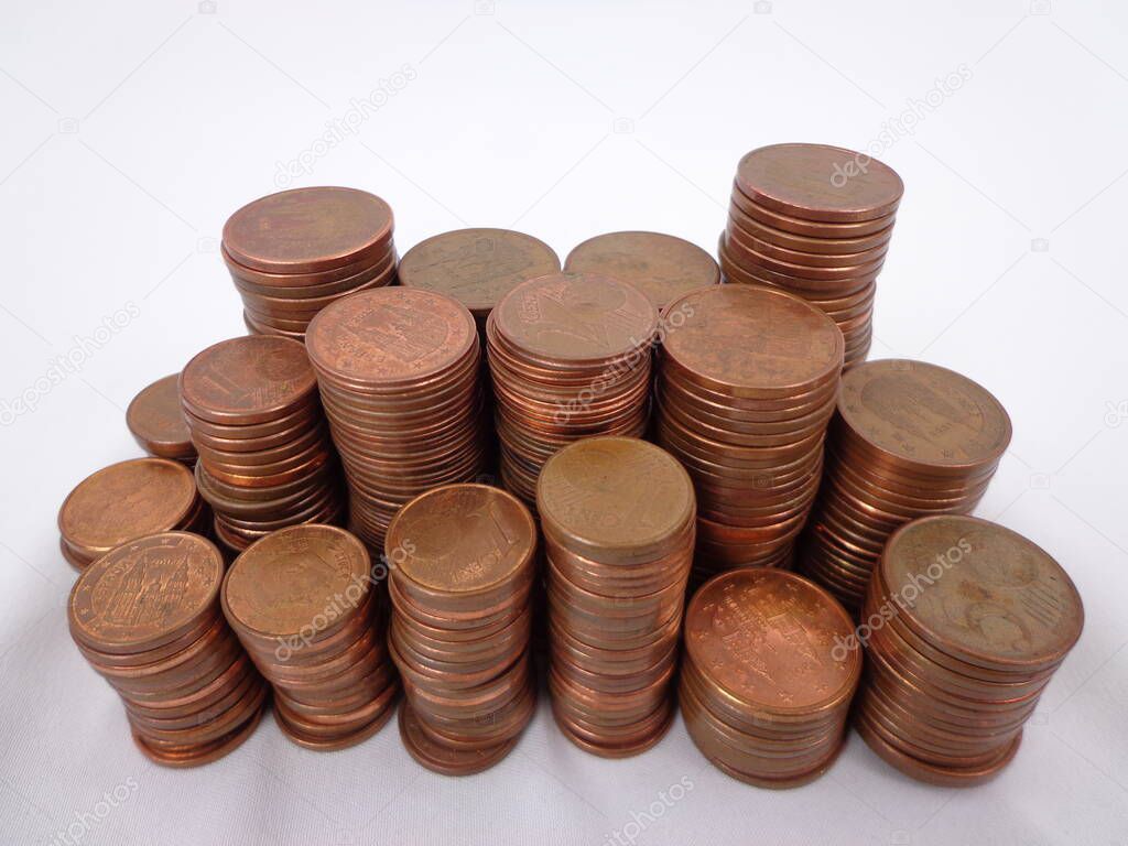 Stacked coins, isolated on a white background